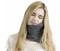 woman with a grey neck pillow