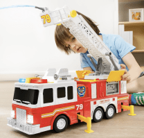 child with a fire truck toy